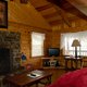 The fireplace and living area of the Mountain Ecstasy cabin