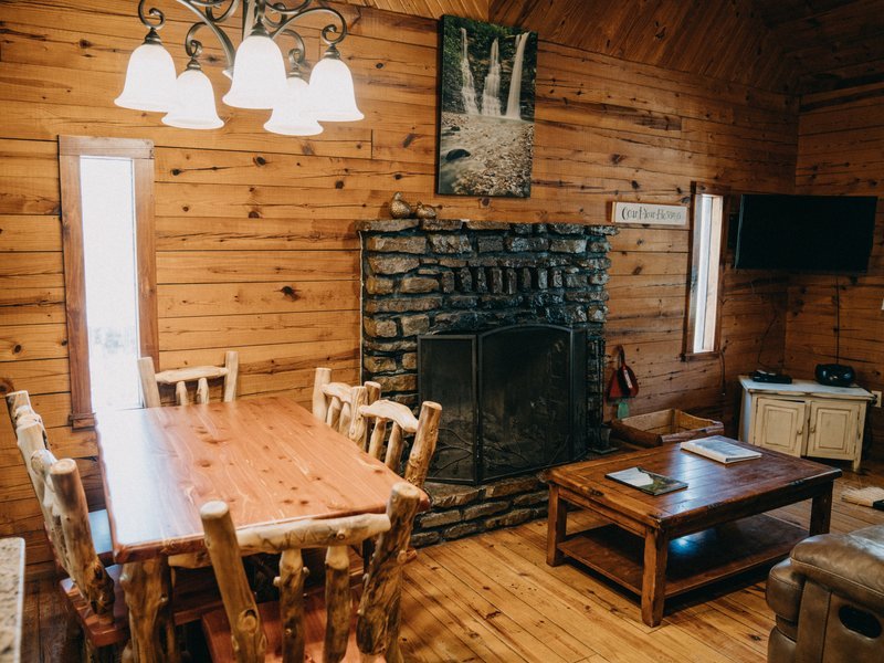 Living room with nativestone fireplace, Ponca Cabin 1