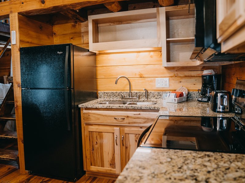 The cabin features a fully furnished kitchen
