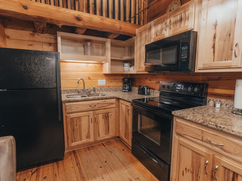 The cabin features a fully furnished kitchen