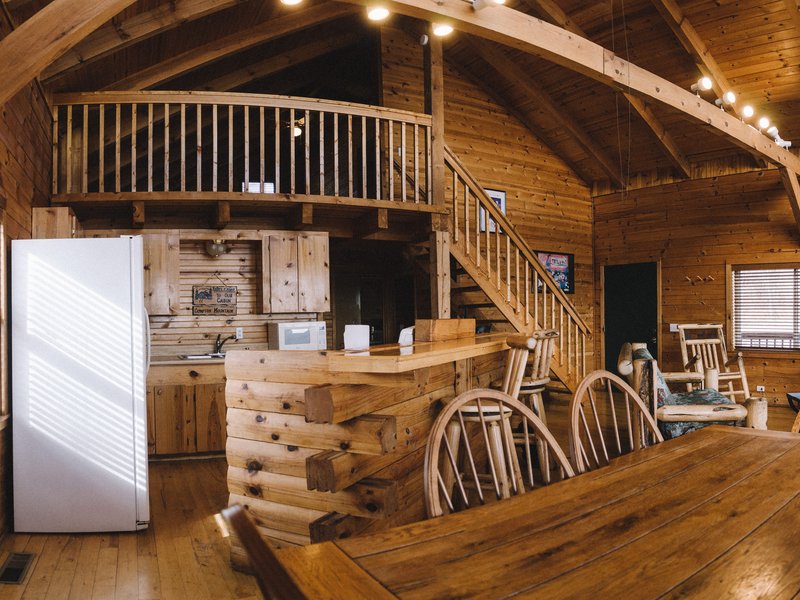 View of the cabin's dining and kitchen areas.