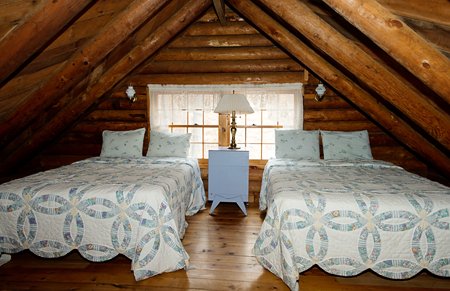 The roomy loft of the Mills Cabin features 2 full-size beds.