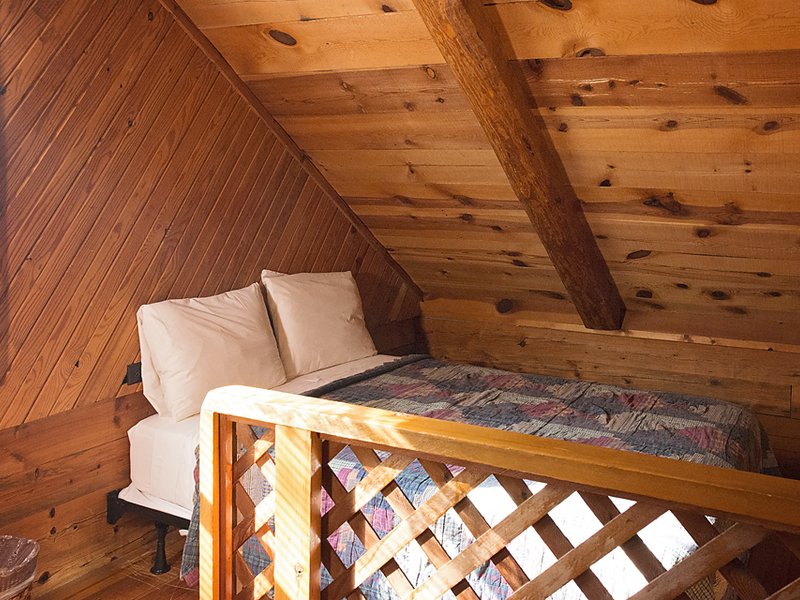The Songbird Cabin's loft features two full-size beds. (only 1 shown in photo)