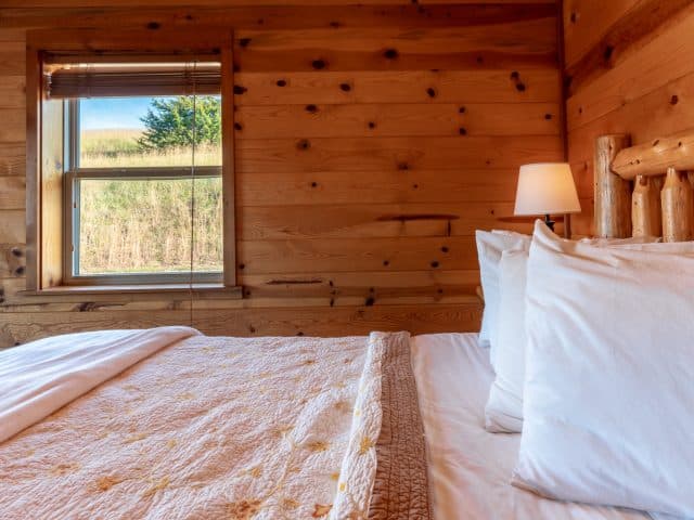 Queen bed in the additional bedroom of the Mountain Sunset cabin
