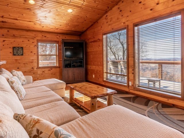Relax in spacious comfort in the living area of the Mountain Sunset Cabin