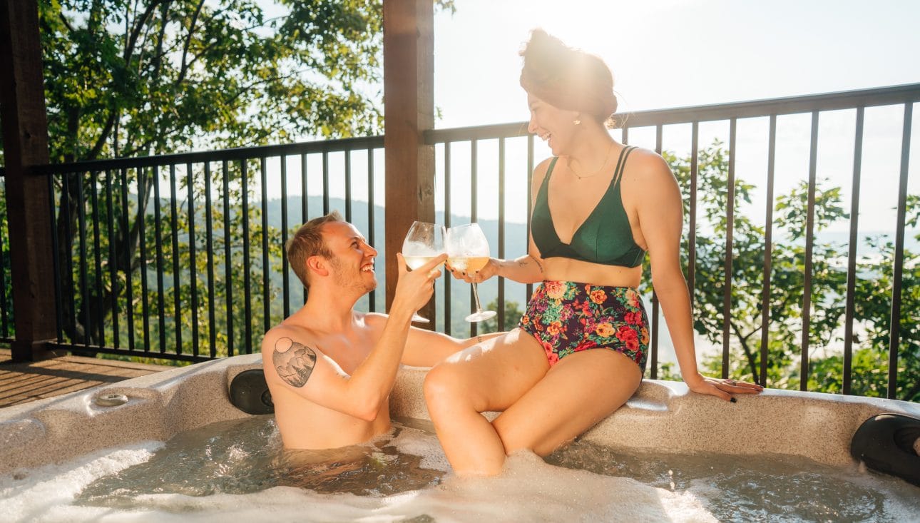 Couple in hot tub at BOC Cabin