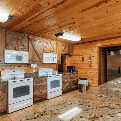 The kitchen of RiverWind Lodge features a commercial-size fridge, double ovens, microwaves and dishwashers.