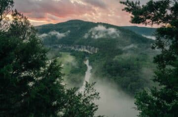 A foggy view at sunset over the Buffalo River from the Steel Creek Overlook.