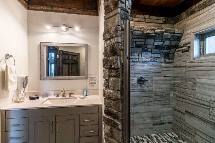The Wildwood Cabin features a unique bathroom with waterfall shower.