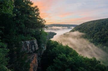 A colorful sunrise and fog at Whitaker Point / Hawksbill Crag.