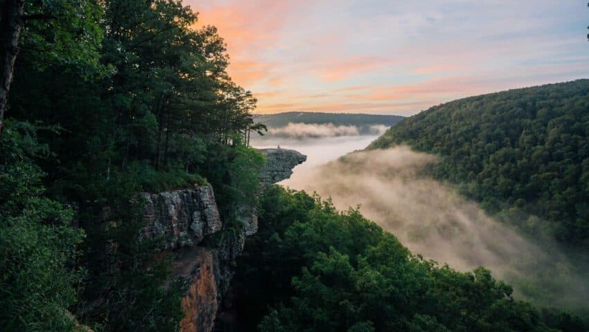 A colorful sunrise and fog at Whitaker Point / Hawksbill Crag.