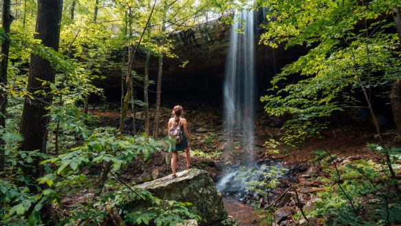 A Hiker taking in the view f Hideout Hollow Falls.