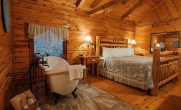The Valley Secret Cabin's bedside slipper tub and kingsize bed make for a terrific romantic getaway in Buffalo River country.