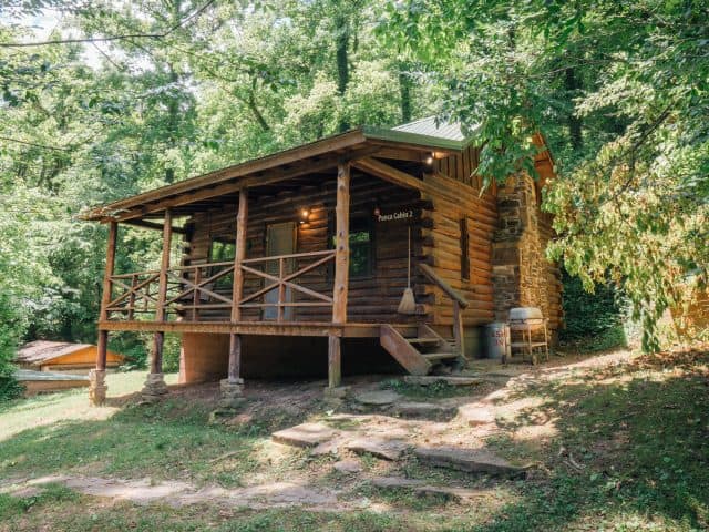 Cabin 2 is located in Ponca and features a spacious yard for the kids to romp in.