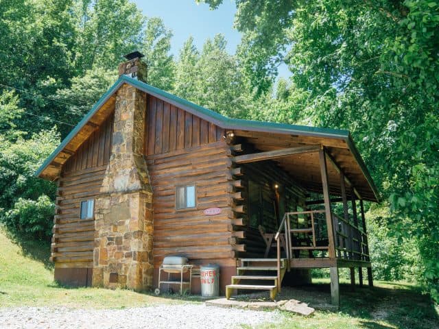 The Songbird Cabin in its tucked-away location is the perfect place for porch time in Ponca.