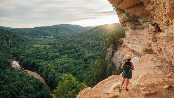 A hiker along the Goat Trail at sunset.