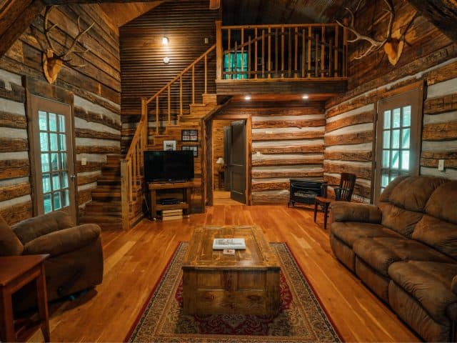 The Elkhorn Cabin with its cozy living area and historic log walls take you back in time, yet has the modern comforts of home.