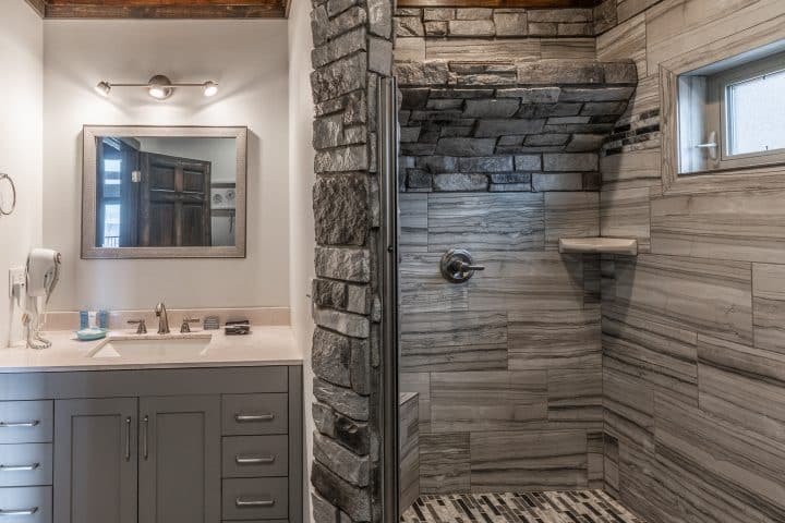 Treat yourself to a waterfall shower in the Foxfire Cabin's beautiful showerbath.