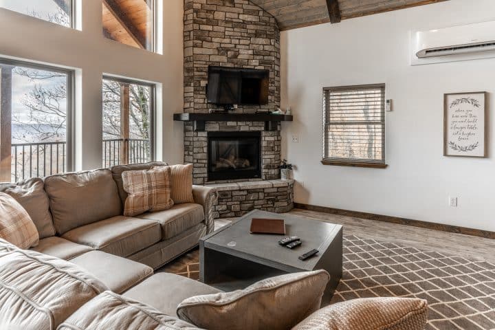 The Foxfire Cabin's vaulted ceiling and elegant, spacious living room are perfect for a family vacation, gathering of friends or romantic getaway,.