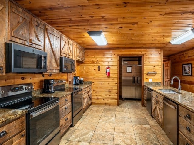 The kitchen of RiverWind Lodge features a commercial-size fridge, double ovens, microwaves and dishwashers.