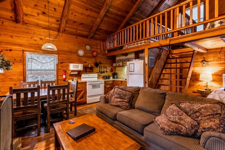 The Songbird Cabin features an open floor plan and upstairs sleeping loft, which is perfect for families.