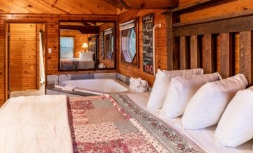 The perfect romantic escape awaits you in the Mountain Ecstasy Cabin with its bedside jacuzzi and woodburning fireplace.