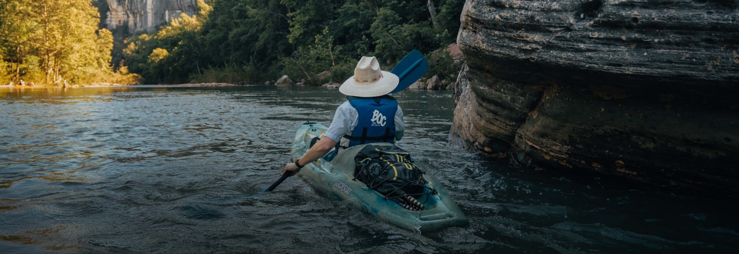 Man kayaking on a river