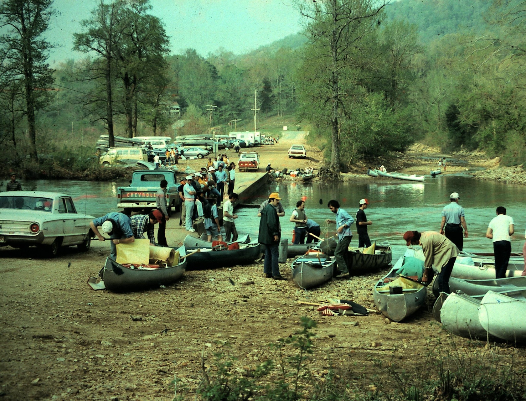 Vintage image from 70's of people putting on canoes at the Ponca Access.