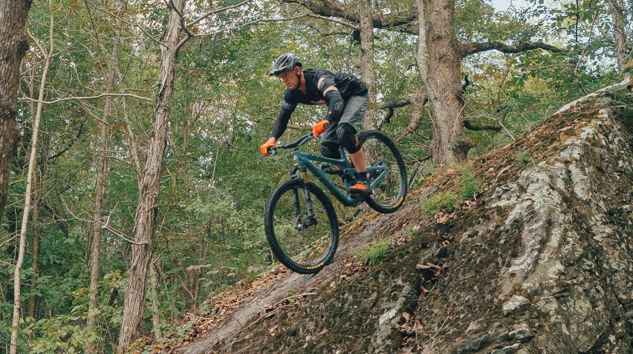 biking down a steep trail