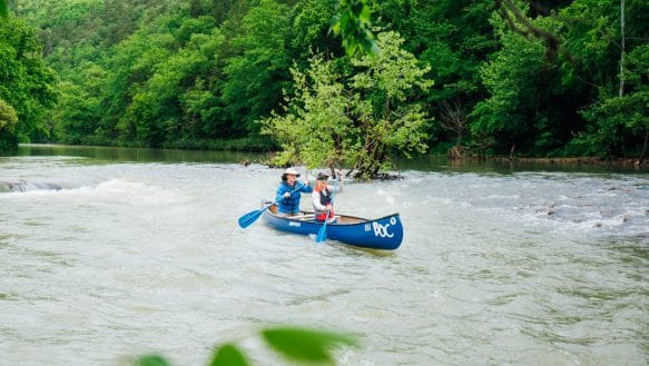 Couple canoeing on the Buffalo National River at Steel Creek.