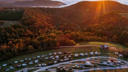 Camper vans at the BOC RV Park at sunrise for the 2021 Vanarky fall campout.