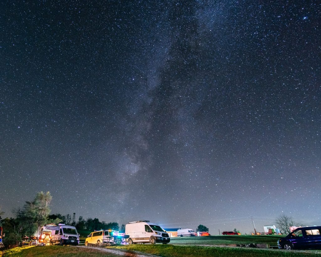 Milky Way over camper vans at the Buffalo Outdoor Center RV campground during Vanarky in the Ozarks..