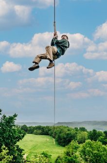 A man zipping on the Buffalo River Canopy Tour.
